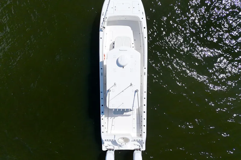 Slide: The Image of Overhead view of 2022 Invincible 33 Catamaran on water. - 9