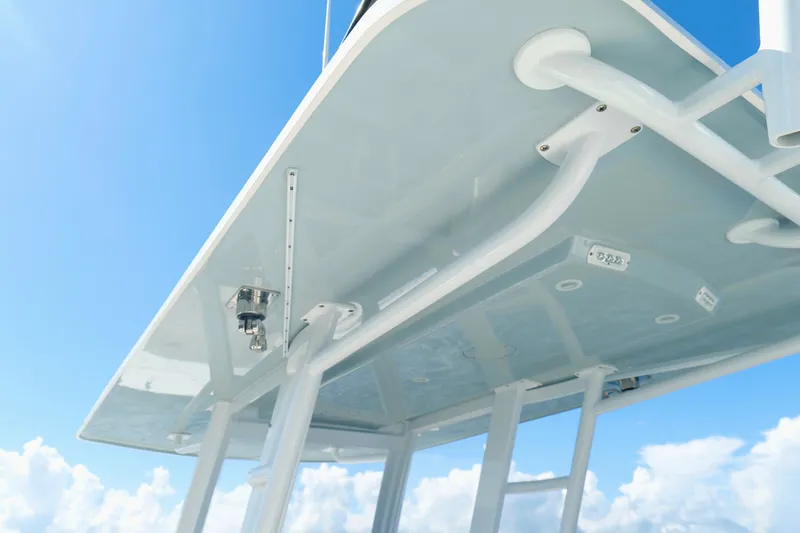 Slide: The Image of 2022 Invincible 33 Catamaran T-top against a clear blue sky. - 18