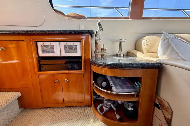 Slide: The Image of Interior of 2000 Carver 53 Voyager yacht with wooden cabinetry and modern decor. - 33