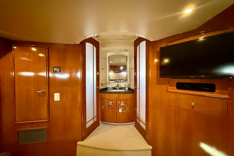 Slide: The Image of Luxurious interior of 2000 Carver 53 Voyager yacht with wood paneling and modern amenities. - 50