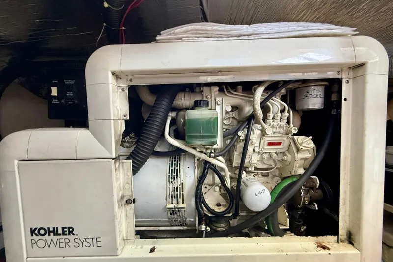 Slide: The Image of Kohler power system in a 2000 Carver 53 Voyager yacht engine room. - 97