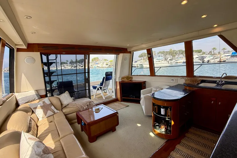 Slide: The Image of Luxurious interior of 2000 Carver 53 Voyager yacht with waterfront view. - 13
