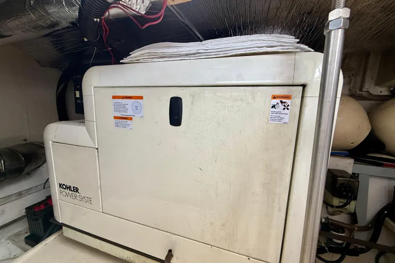 Slide: The Image of Engine room of 2000 Carver 53 Voyager with Kohler power system. - 96