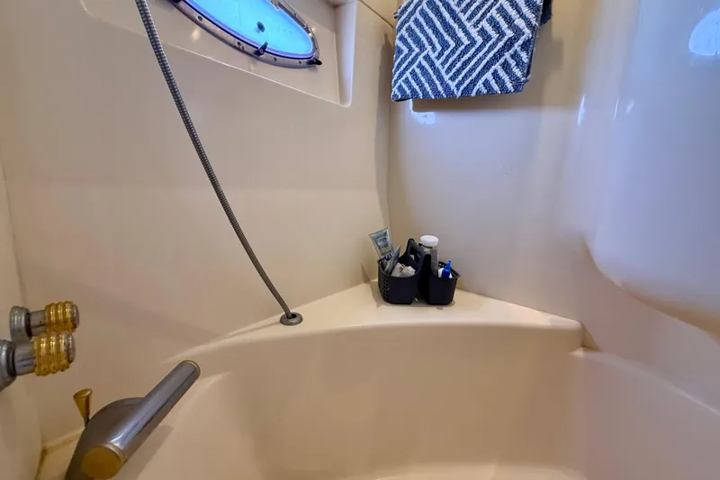 Slide: The Image of Bathroom corner in 2000 Carver 53 Voyager yacht with toiletries and towel. - 48