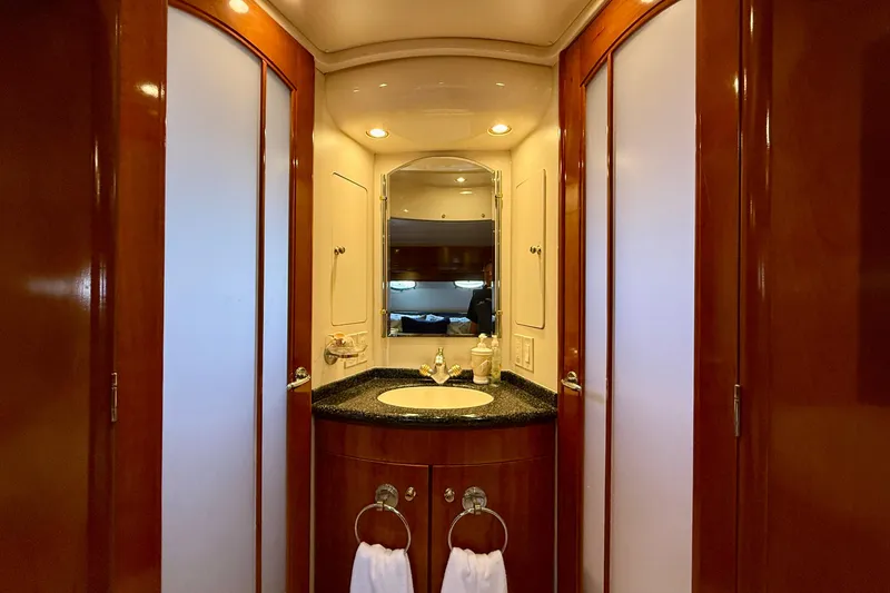 Slide: The Image of Luxurious bathroom interior of 2000 Carver 53 Voyager yacht with elegant wood finishes. - 51