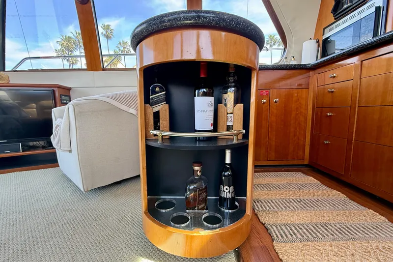 Slide: The Image of Interior of 2000 Carver 53 Voyager yacht with a built-in wine cabinet. - 32