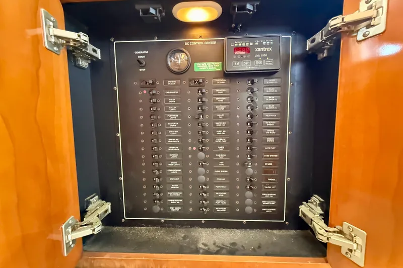 Slide: The Image of Electrical control panel inside a 2000 Carver 53 Voyager yacht cabinet. - 92