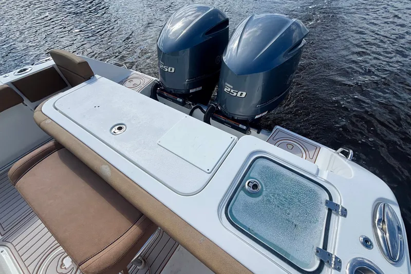 Slide: The Image of 2021 Sea Hunt Gamefish 27FS boat with dual Yamaha 250 engines on water. - 15
