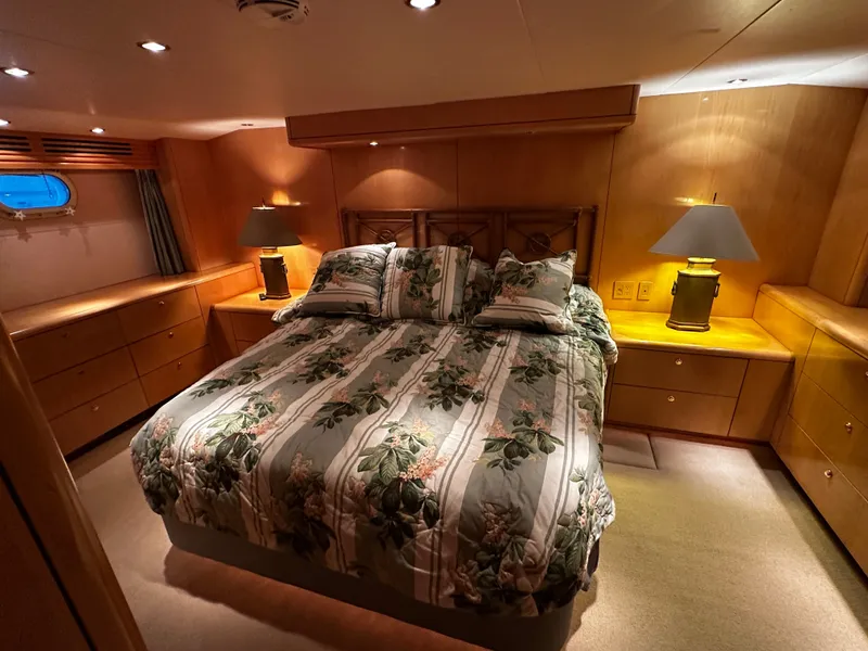Slide: The Image of The image shows a cozy cabin with a large bed, wooden furniture, and soft lighting. - 16