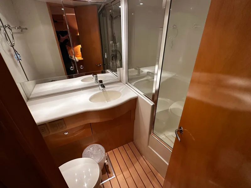 Slide: The Image of The image shows an elegant bathroom with wood paneling, a sink, and a shower. - 20