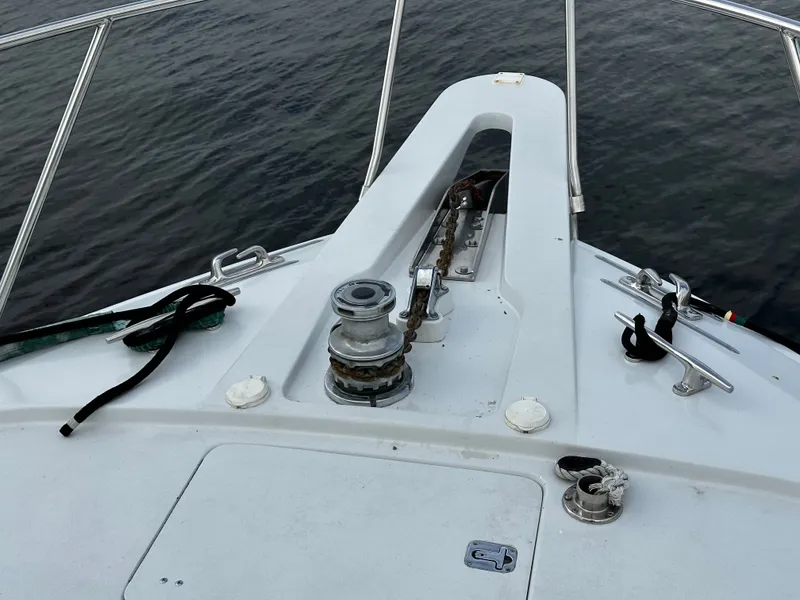 Slide: The Image of Bow view of a 2000 Hatteras 70 Convertible with windlass and railing. - 46