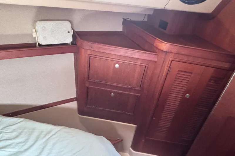 Slide: The Image of Interior cabin of 2000 Island Packet 380 sailboat with wooden cabinetry. - 18