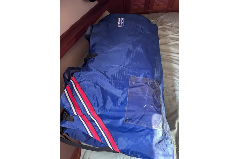 Slide: The Image of Blue duffel bag with red and white stripes on Island Packet 380, 2000 model. - 27
