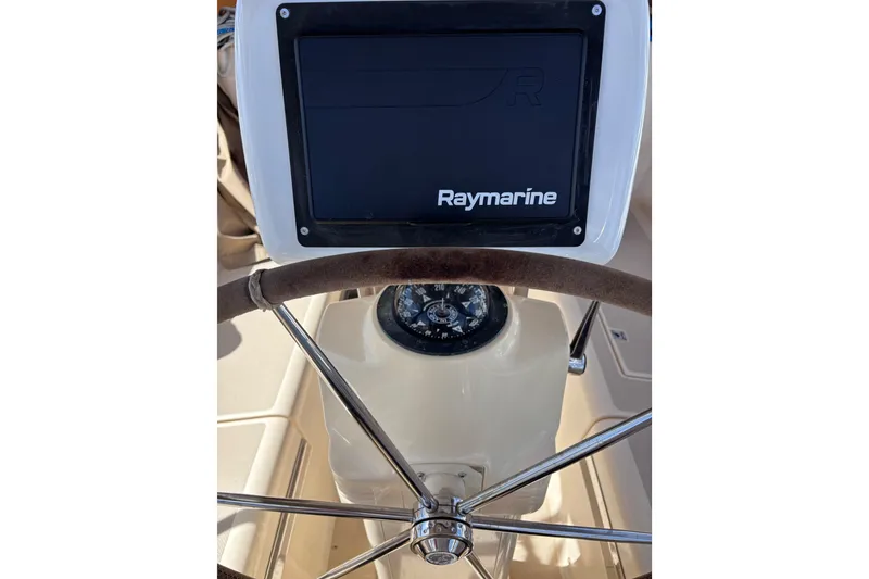 Slide: The Image of Steering wheel and Raymarine display on 2000 Island Packet 380 sailboat. - 45