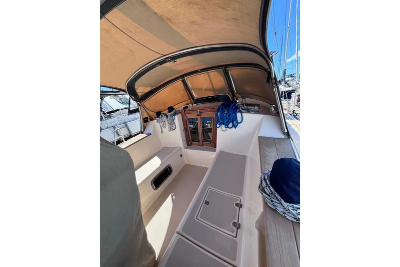 Slide: The Image of Cockpit of 2000 Island Packet 380 sailboat with canopy and nautical equipment. - 52