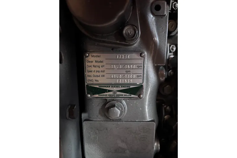 Slide: The Image of Yanmar diesel engine plate on 2000 Island Packet 380 sailboat, model 4JH3E. - 32