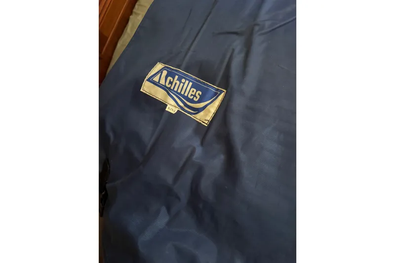 Slide: The Image of Blue fabric with "Achilles" logo, related to Island Packet 380, 2000 model. - 26