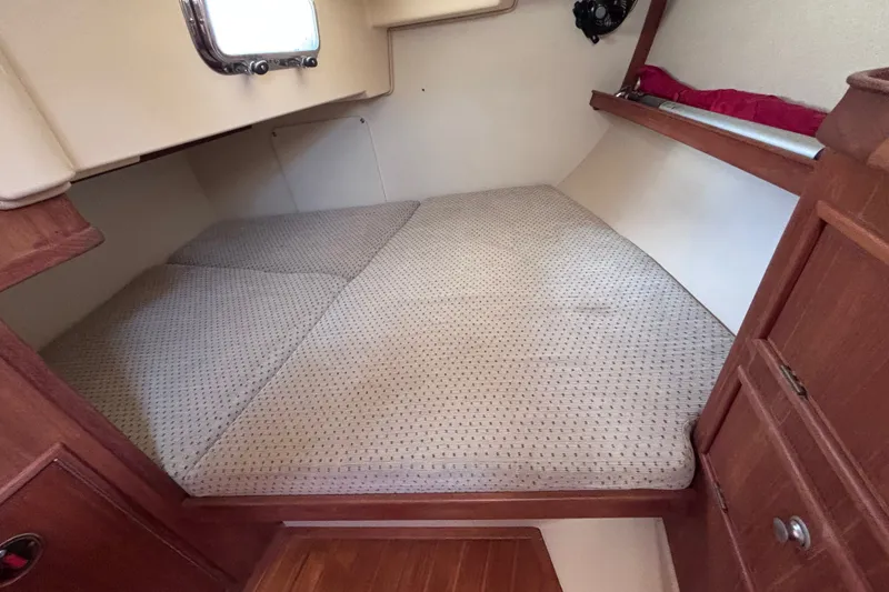 Slide: The Image of Cozy cabin interior of 2000 Island Packet 380 sailboat with comfortable bedding. - 35