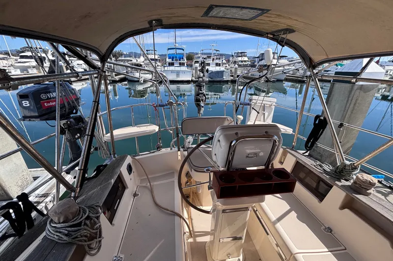 Slide: The Image of Cockpit view of a 2000 Island Packet 380 sailboat docked at a marina. - 42