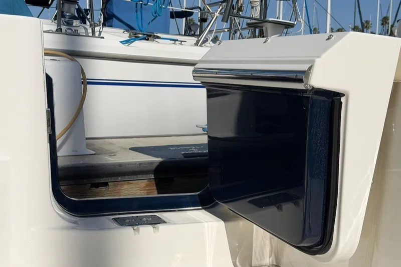 Slide: The Image of The 2021 Pursuit DC 326 Dual Console features an open door to the swim platform. - 23