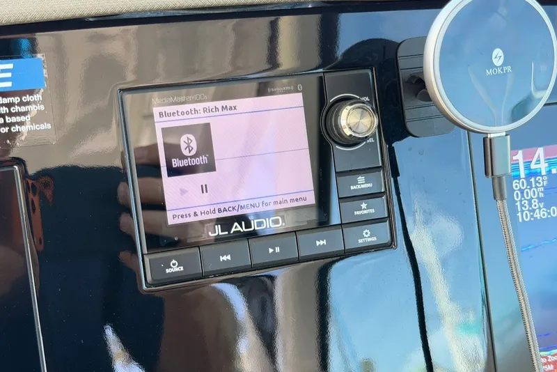 Slide: The Image of JL Audio system with Bluetooth display on a boat. - 38