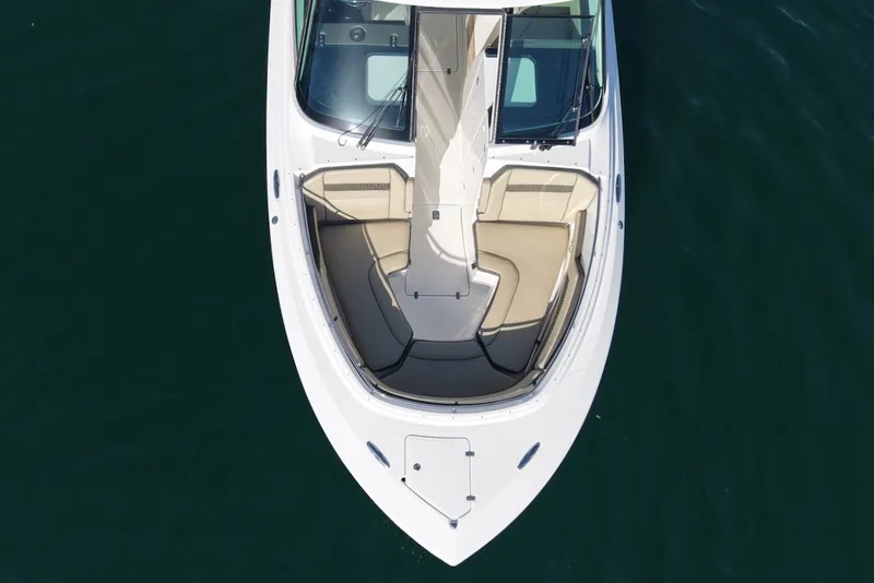 Slide: The Image of Aerial view of a 2021 Pursuit DC 326 Dual Console boat with beige seating area. - 40