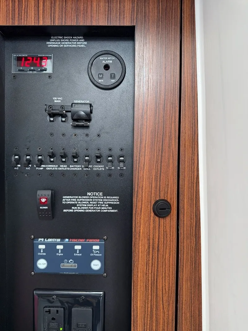 Slide: The Image of Electrical panel with wood trim, featuring various switches and displays. - 45