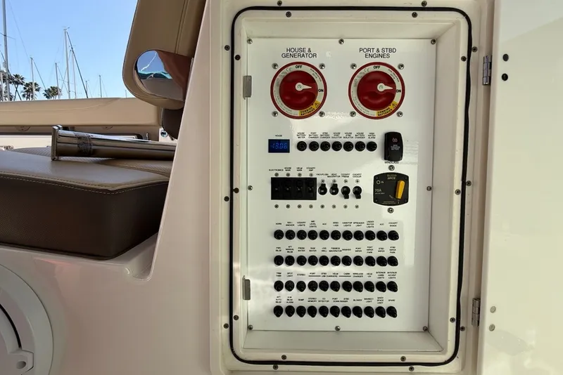 Slide: The Image of Control panel of the 2021 Pursuit DC 326 Dual Console with various switches and indicators. - 21