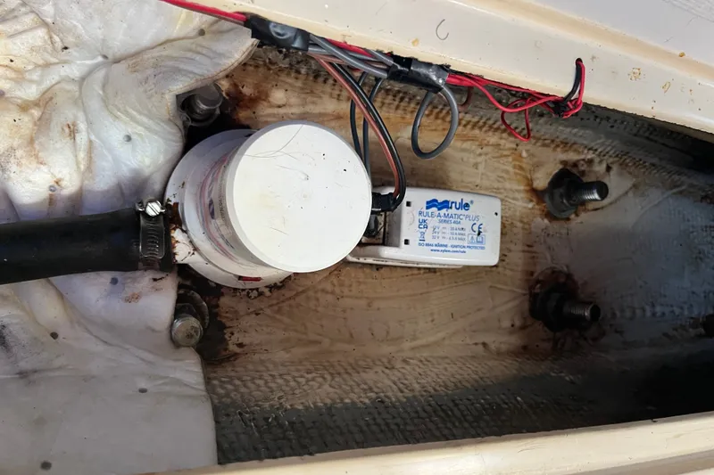 Slide: The Image of Bilge pump system in a 1985 Catalina 30 sailboat, featuring Rule-A-Matic Plus switch. - 38