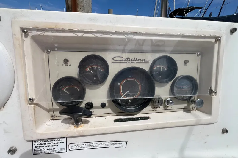 Slide: The Image of Dashboard of a 1985 Catalina 30 yacht with gauges and controls. - 10