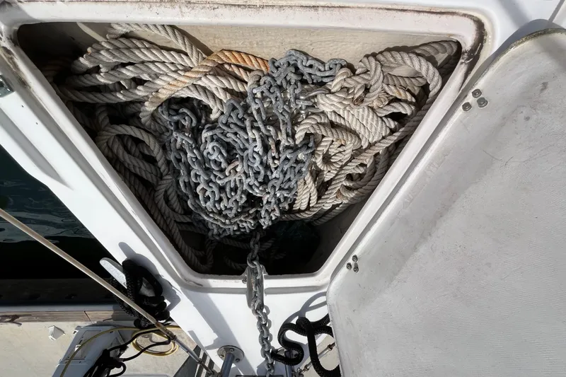 Slide: The Image of Anchor locker of a 1985 Catalina 30 sailboat with ropes and chains. - 4