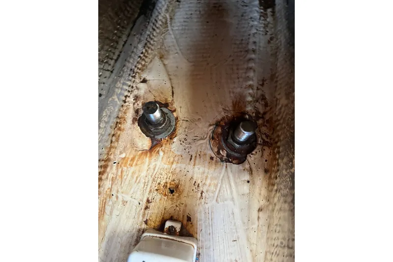 Slide: The Image of Rusty bolts on 1985 Catalina 30 boat interior, showing wear and corrosion. - 39