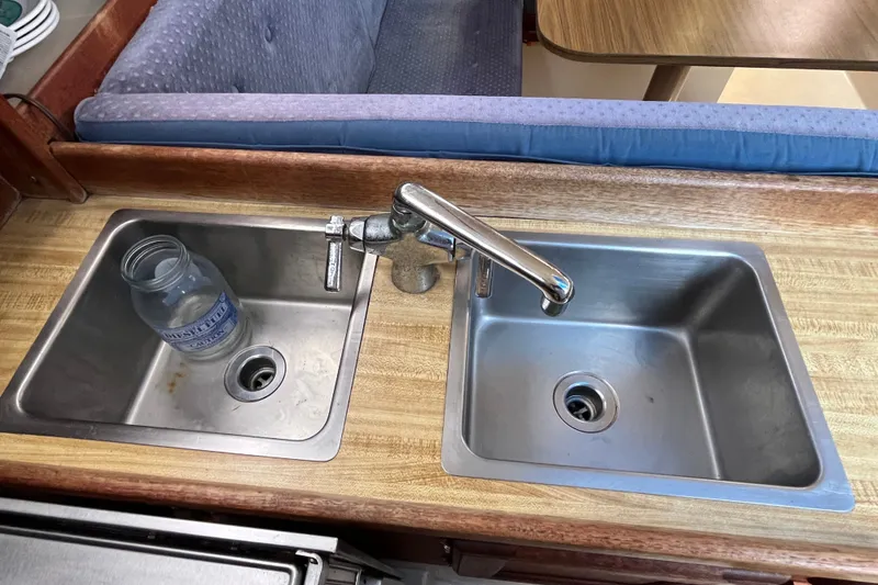 Slide: The Image of Dual stainless steel sinks in 1985 Catalina 30 yacht kitchen interior. - 22