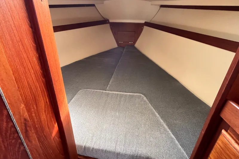 Slide: The Image of Interior cabin of 1985 Catalina 30 sailboat with cozy sleeping area. - 26