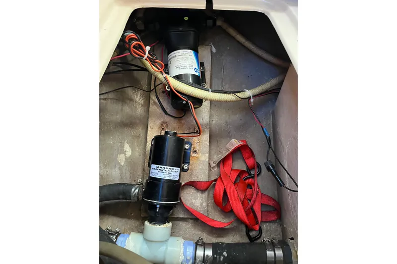 Slide: The Image of Bilge area of a 1985 Catalina 30 sailboat with macerator pump and wiring. - 36