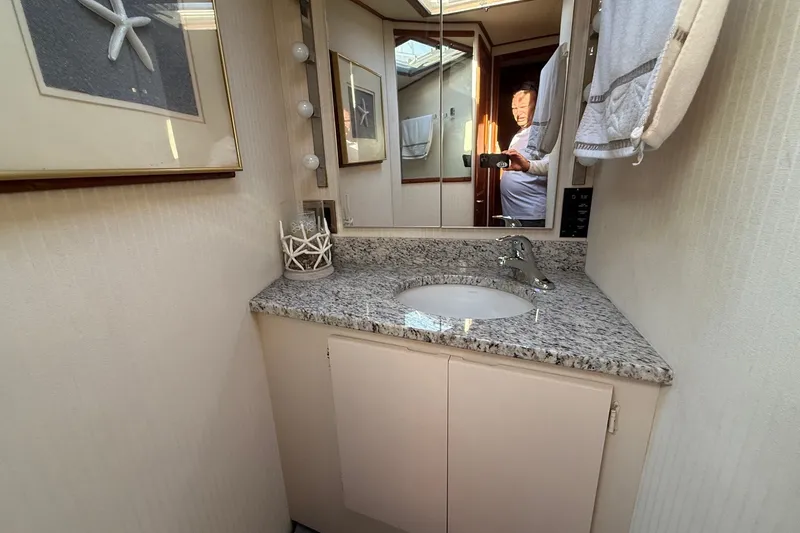 Slide: The Image of Bathroom vanity with granite countertop in 1989 Viking 48 Convertible yacht. - 29