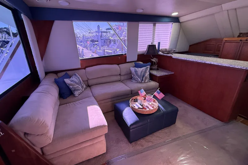 Slide: The Image of Luxurious interior of 1989 Viking 48 Convertible yacht with plush seating and decor. - 17