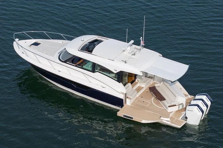 Slide: The Image of Manufacturer Provided Image: 2025 Tiara Yachts 48 LE luxury boat on water, showcasing sleek design and spacious deck. - 5