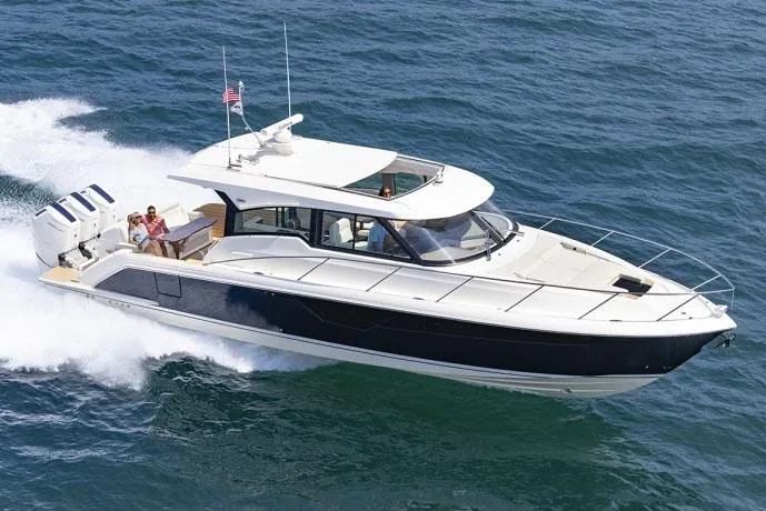 Slide: The Image of Manufacturer Provided Image: 2025 Tiara Yachts 48 LE cruising on open water, showcasing sleek design and powerful engines. - 0