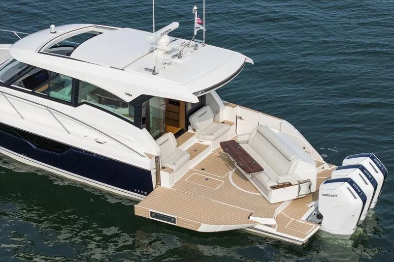 Slide: The Image of Manufacturer Provided Image: 2025 Tiara Yachts 48 LE luxury boat on water, featuring spacious deck and modern design. - 6