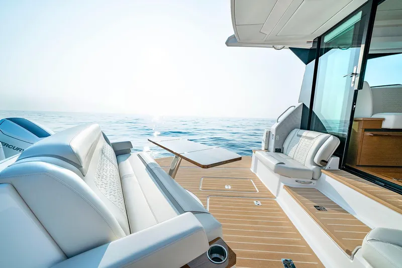 Slide: The Image of Manufacturer Provided Image: Luxurious 2025 Tiara Yachts 48 LE deck with elegant seating and ocean view. - 10