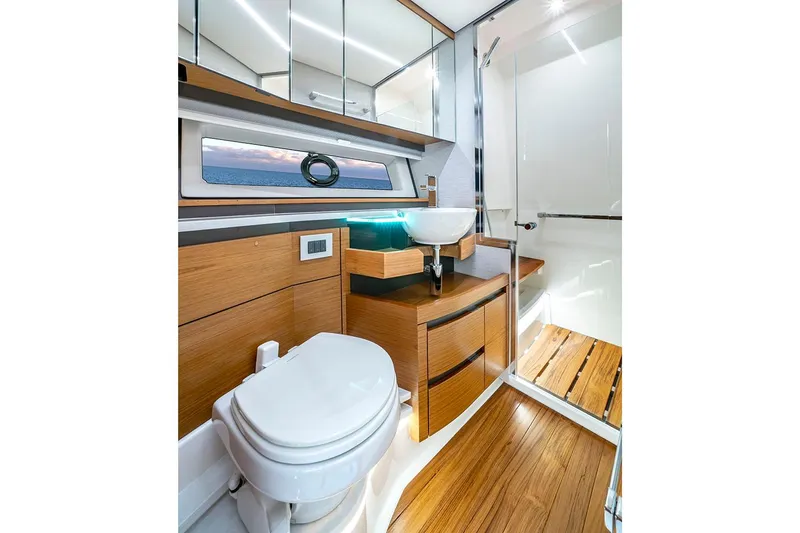 Slide: The Image of Manufacturer Provided Image: Luxurious bathroom in 2025 Tiara Yachts 48 LE, featuring modern fixtures and wood accents. - 21