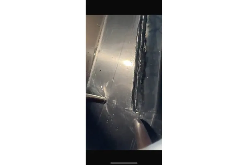 Slide: The Image of Close-up of a boat floor with scratches and signs of wear. - 7