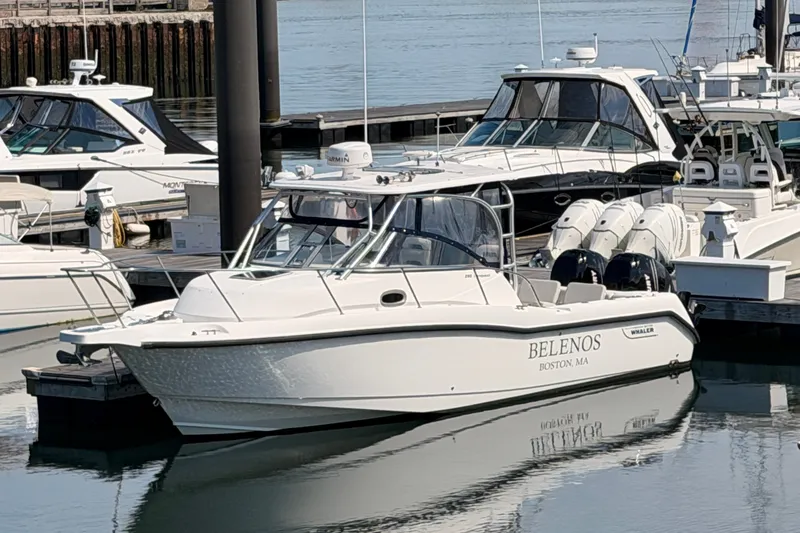 The Image of 2006 Boston Whaler 285 Conquest boat docked in marina, labeled "BELENOS" from Boston, MA. - 0