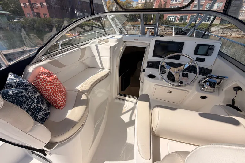 Slide: The Image of Interior of a 2006 Boston Whaler 285 Conquest boat with helm and seating area. - 16
