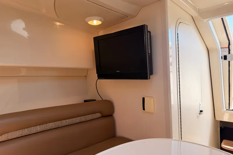 Slide: The Image of Interior of 2006 Boston Whaler 285 Conquest with TV and seating area. - 25
