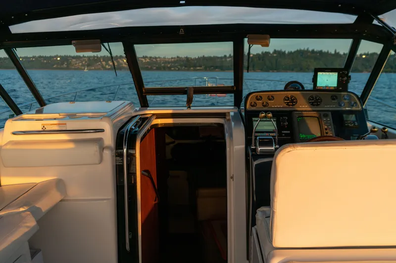 Slide: The Image of Cockpit view of 2001 Tiara Yachts 3100 Open, featuring helm and navigation equipment. - 15