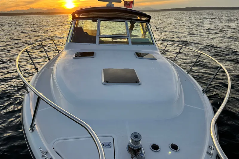 Slide: The Image of 2001 Tiara Yachts 3100 Open at sunset on the water. - 13