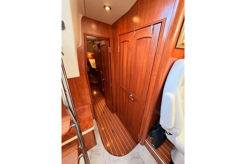 Slide: The Image of Interior of 2009 Hunter 50 Center Cockpit yacht with wooden paneling and cozy cabin. - 76
