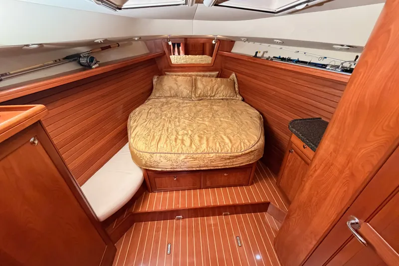 Slide: The Image of Luxurious 2009 Hunter 50 Center Cockpit interior with wood paneling and cozy bed. - 67